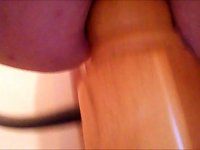 Anal slut fists herself and sits on a bedpost